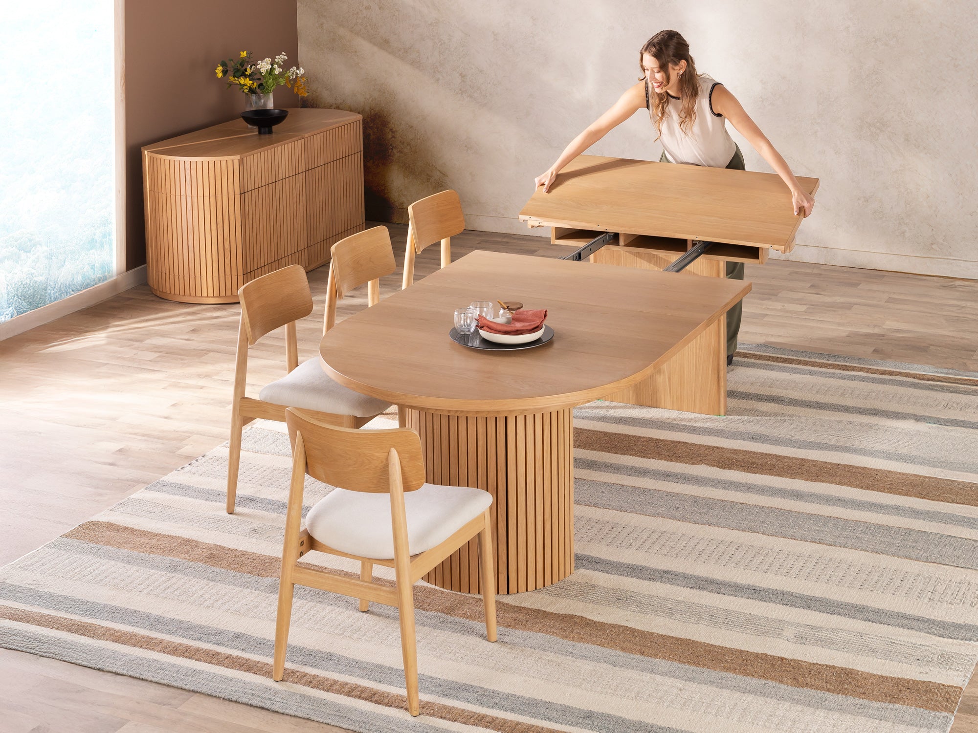 Transformer-round-table-scandinavian-oak-the-family-functionality-lifestyle-model-4x3-1 Round Dining Set - The Family - Image 1
