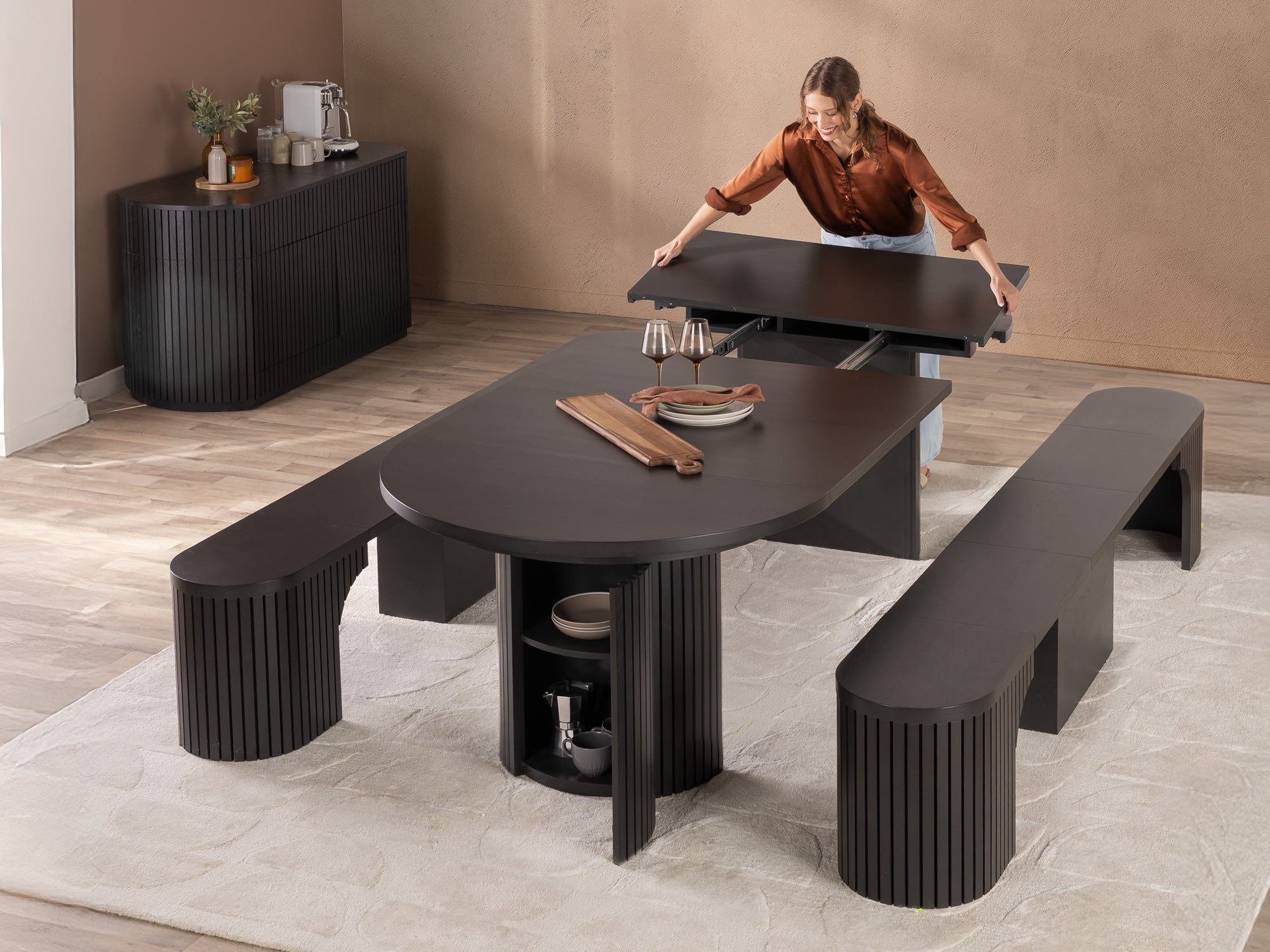 Transformer-round-table-smoked-hickory-the-gathering-functionality-lifestyle-model-4x3-1 Round Dining Set - The Gathering - Image 1